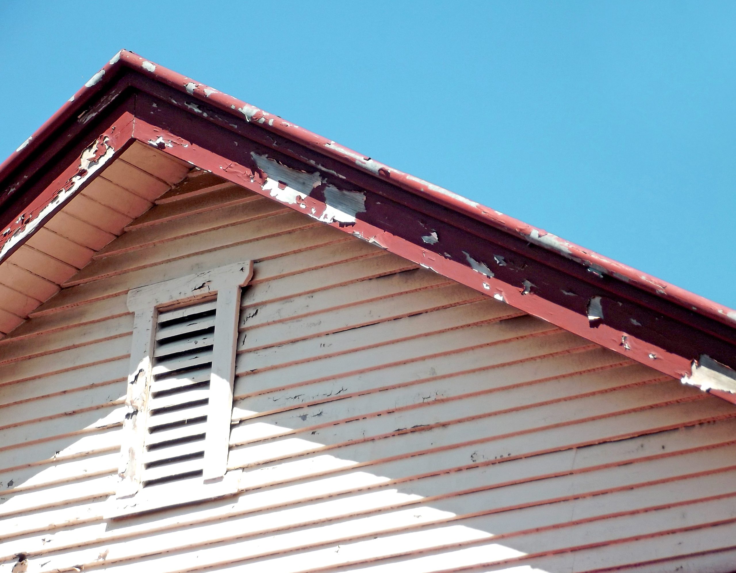 peeling paint discovered by a roof inspector